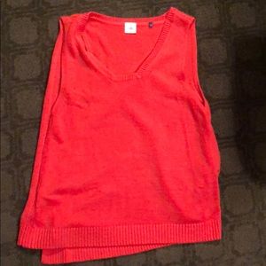 Cabi asymmetrical orange sleeveless sweater.